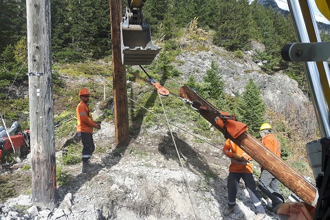 Winching and rigging a pole up from an otherwise inaccessible location.